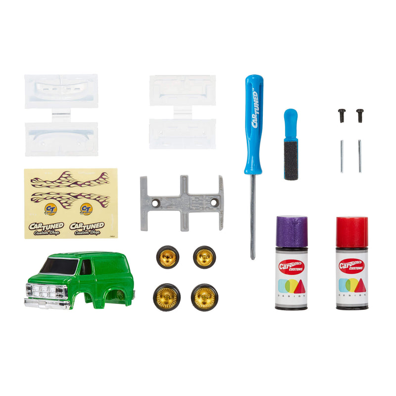 Collection of model car accessories including a green van, wheels, tools, and paint cans on a white background.