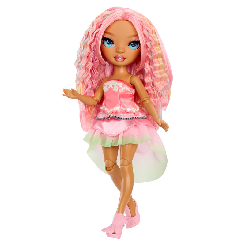 Doll with pink hair and dress on a white background