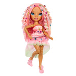 Toy doll with pink hair with gems and a dress on a white background