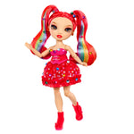 Toy doll with gem in her red hair in pigtails and  red dress on a white background