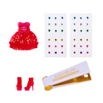 Gems, a small red dress, red high heels, and a 'Rainbow' branded bedazzling tool on a white background.