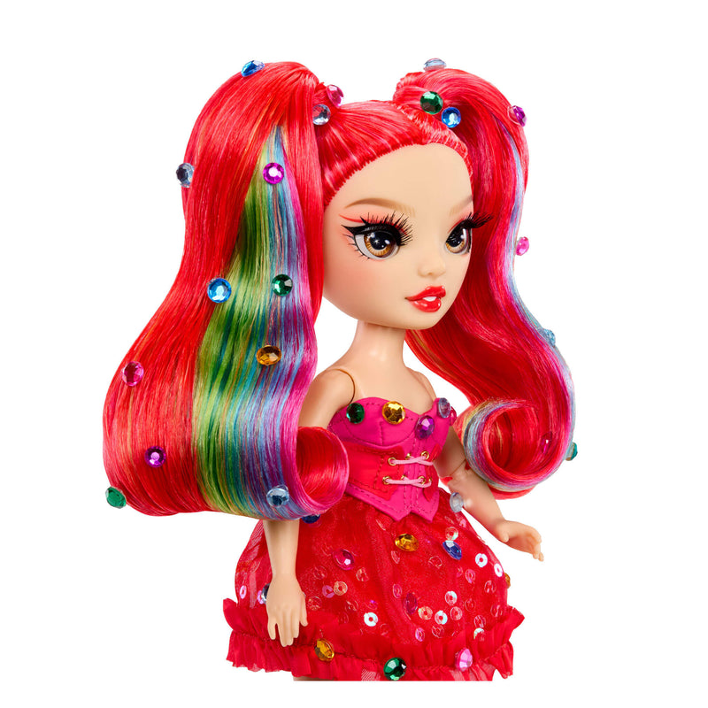 Toy doll with gems in red hair and colorful dress on a white background
