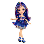 Doll with colorful gems in her hair and outfit on a white background