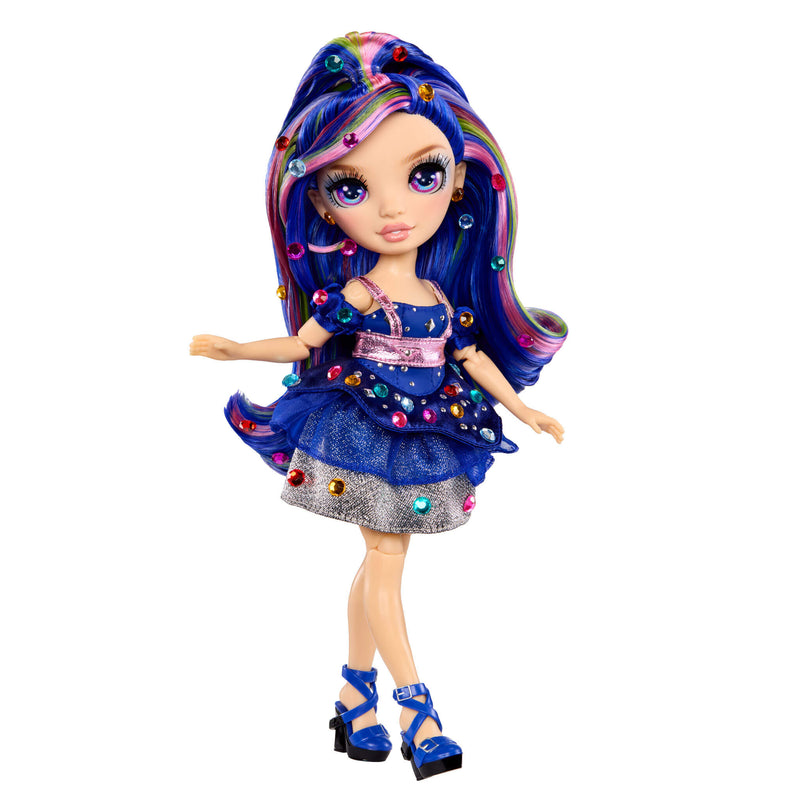 Doll with colorful gems in her hair and outfit on a white background