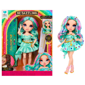 Colorful doll with teal hair and outfit next to its packaging