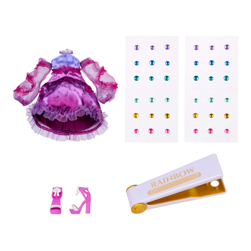 Doll outfit with shoes, gems, and a bedazzling tool on a white background