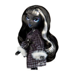 Doll with long black and white hair wearing a patterned robe on a white background