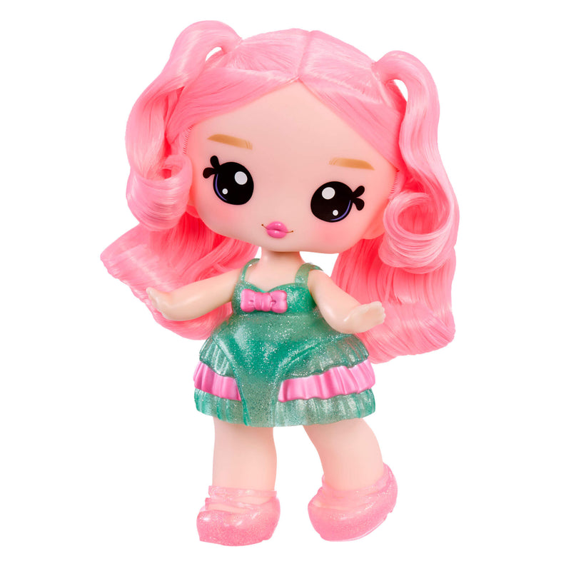 Toy doll with pink hair and a green dress on a white background