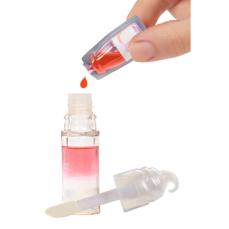 Hand holding a small container of red liquid above a clear dropper bottle with a white cap.