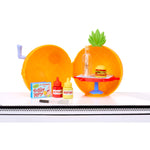 Pineapple-shaped playset, condiments, and a Krabby Patty on a white background