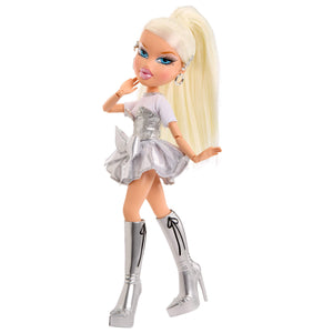 Cloe with blonde hair, white top, and silver skirt on a white background