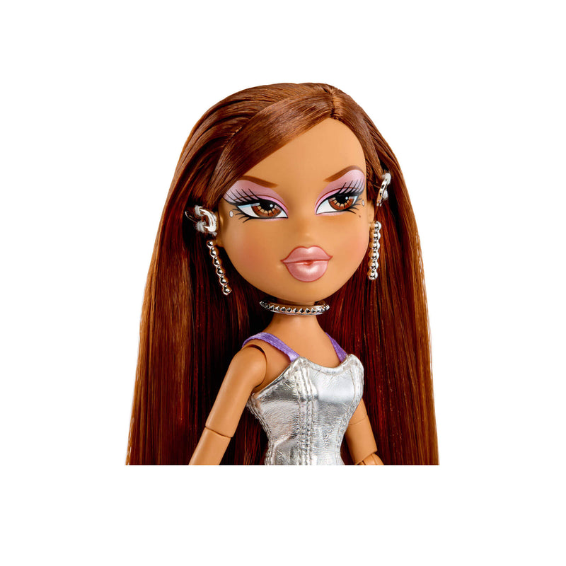 Toy doll with long brown hair and a silver dress on a white background