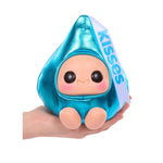 Toy figure of a character in blue with 'Kisses' text, held in a hand against a white background.