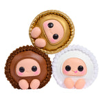 Three cute Reese's character figurines with different colored shells on a white background