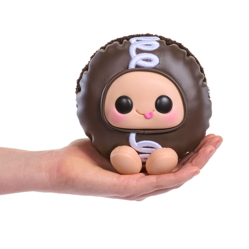 Brown Hostess Cupcake  stuffed toy with a face held in a hand on a white background