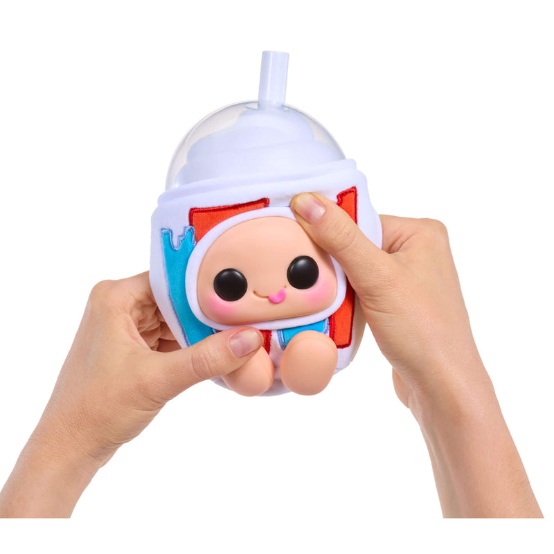 Hand holding a small, cute character white Icee on a white background