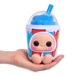 Toy resembling a character in a cup with a straw, held in a hand against a white background