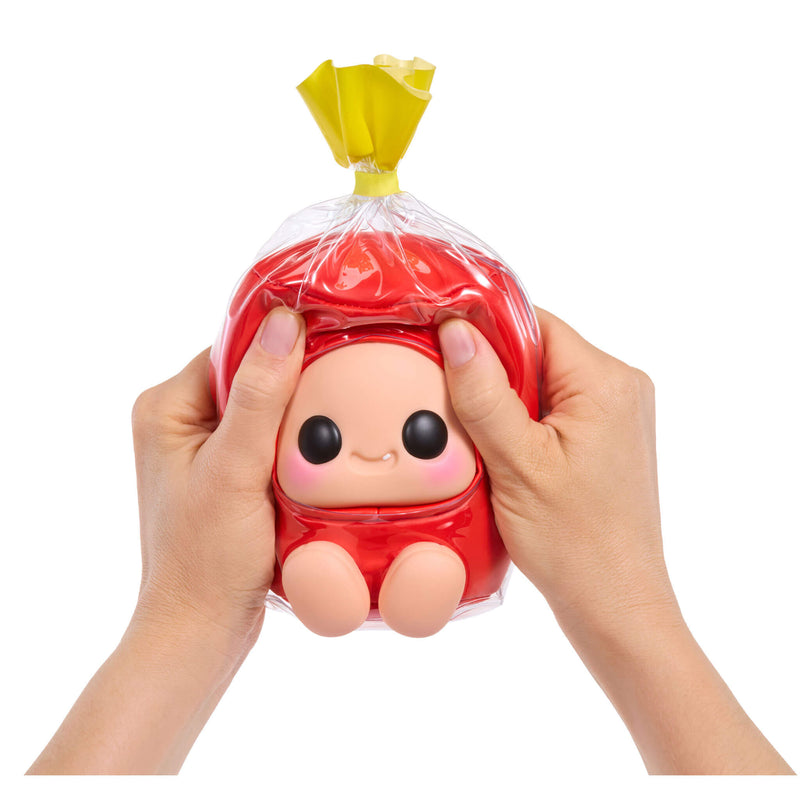 Squishy toy shaped like a character in a red, held by hands on a white background.