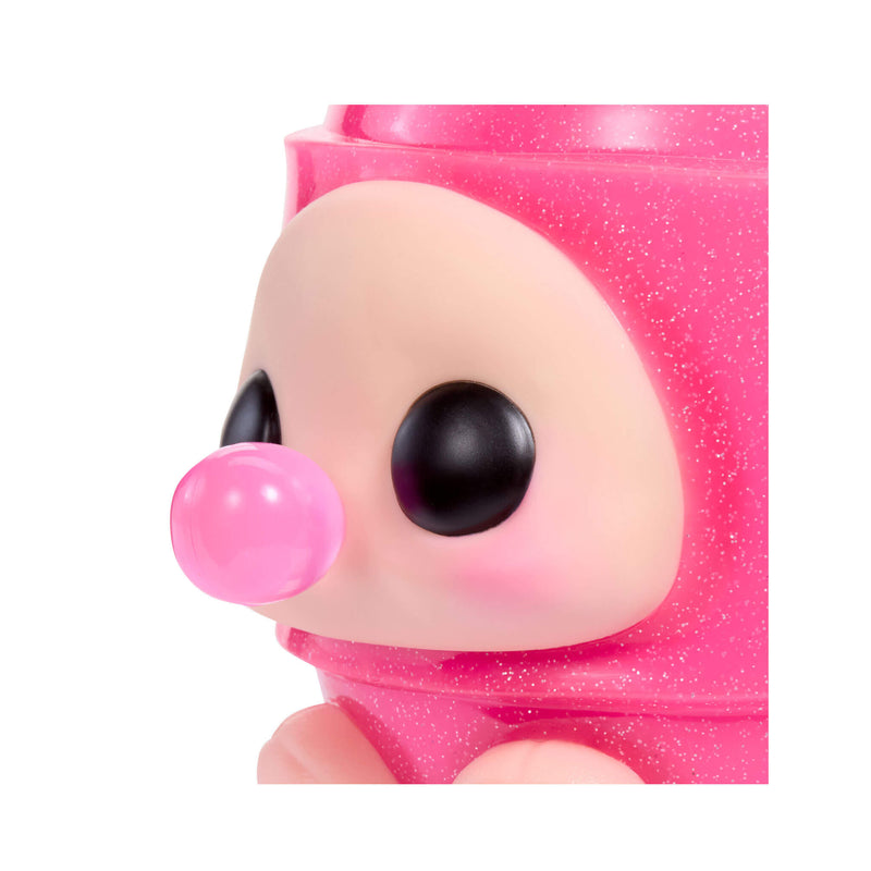 Close-up of a pink glittery toy figure with a bubble, on a white background