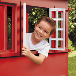 Little Tikes Cape Cottage Playhouse - Red - child looking out window