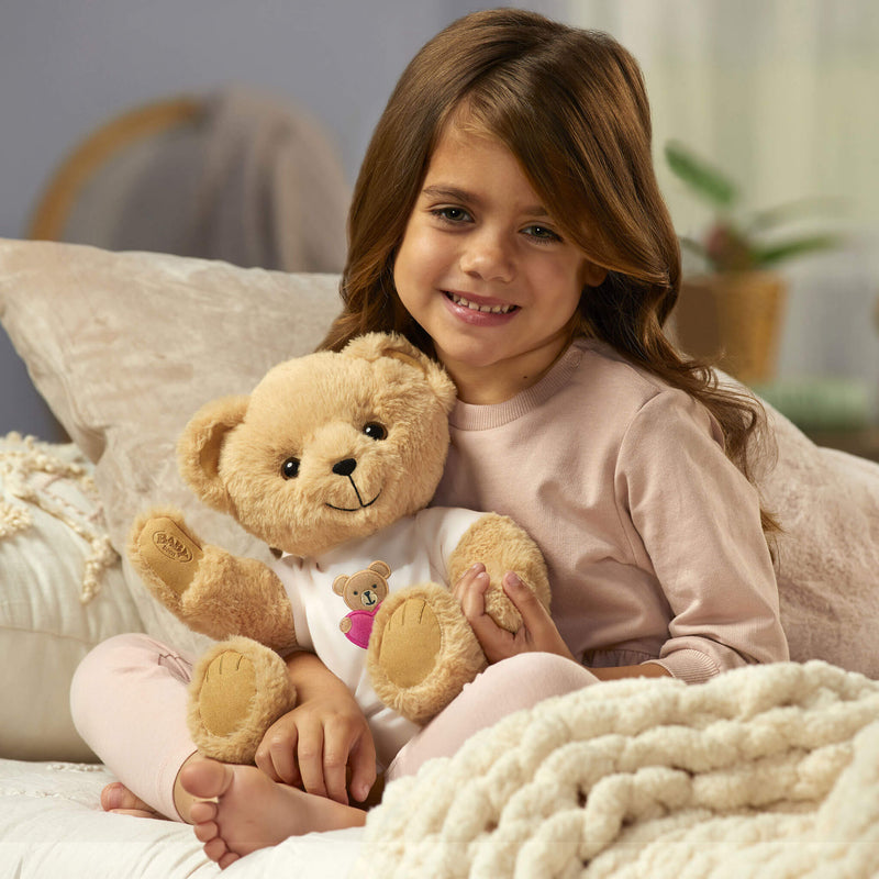 Girl holding teddy bear