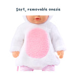 Doll wearing a soft, removable onesie with pink center and white background