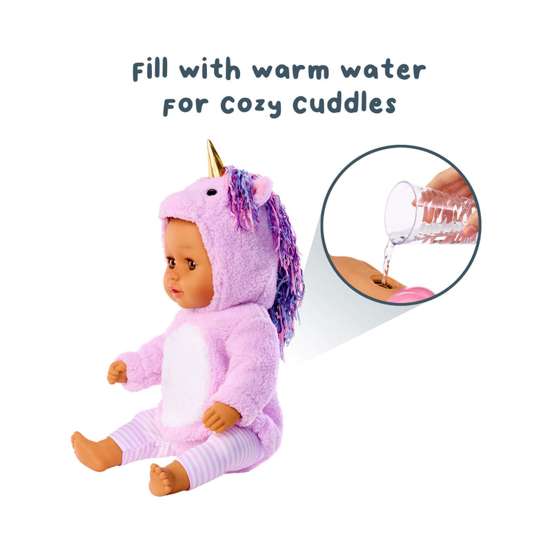 Doll in a unicorn costume with text 'Fill with warm water for cozy cuddles' on a white background.
