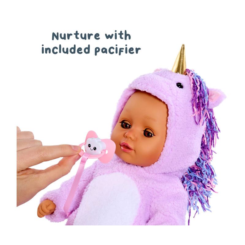 Baby doll in a pink unicorn costume with a pacifier, on a white background.
