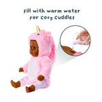 Toy doll in a pink unicorn costume with text 'Fill with warm water for cozy cuddles' and an inset showing water being poured.