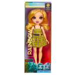 Toy doll with blonde hair and yellow plaid dress in packaging