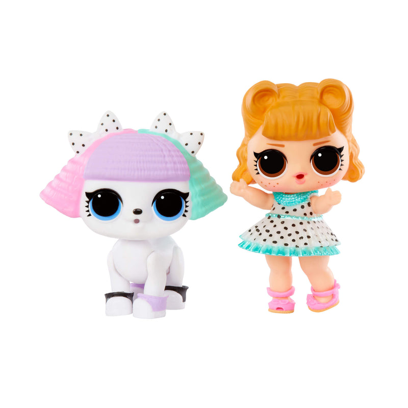 Two toy figures, one white cat with colorful hair and tot girl with blonde hair and a polka dot dress, on a white background.