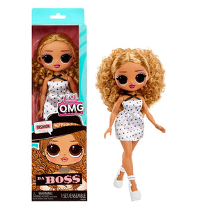Toy doll with curly hair and polka dot dress next to its packaging