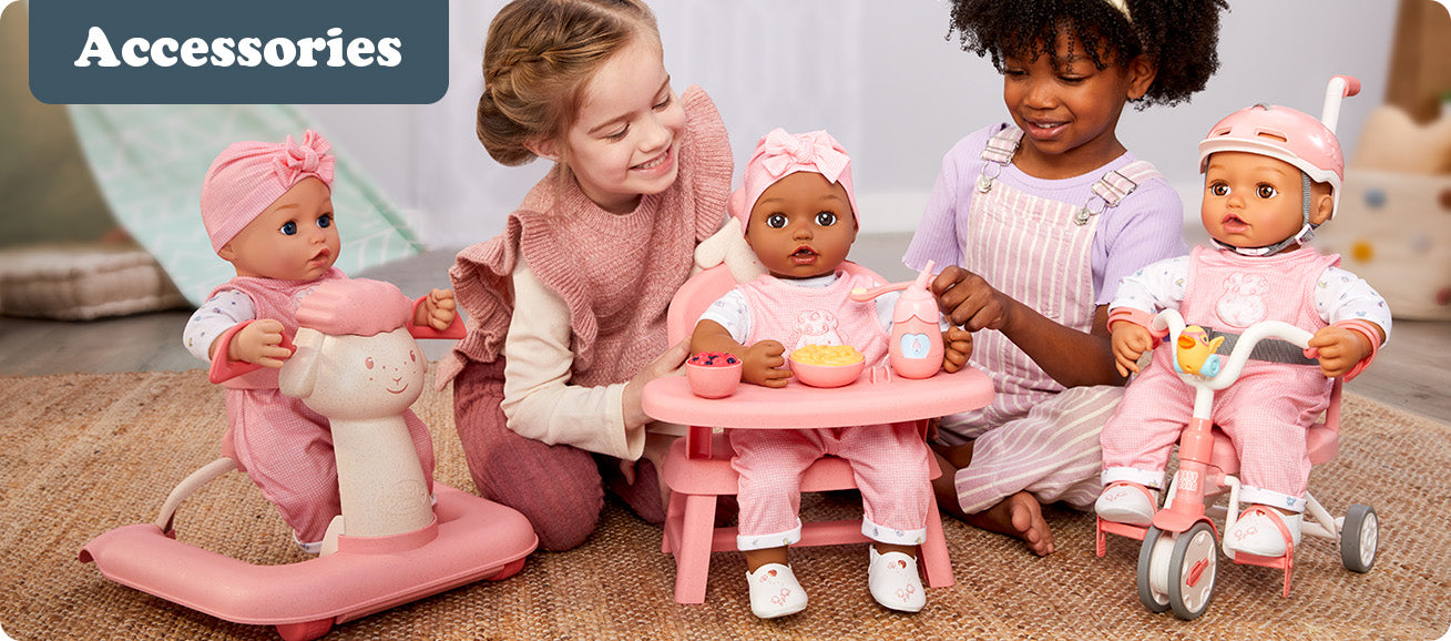 Children playing with dolls and accessories on a carpeted floor.