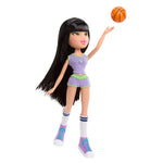 Doll in sports uniform with basketball 