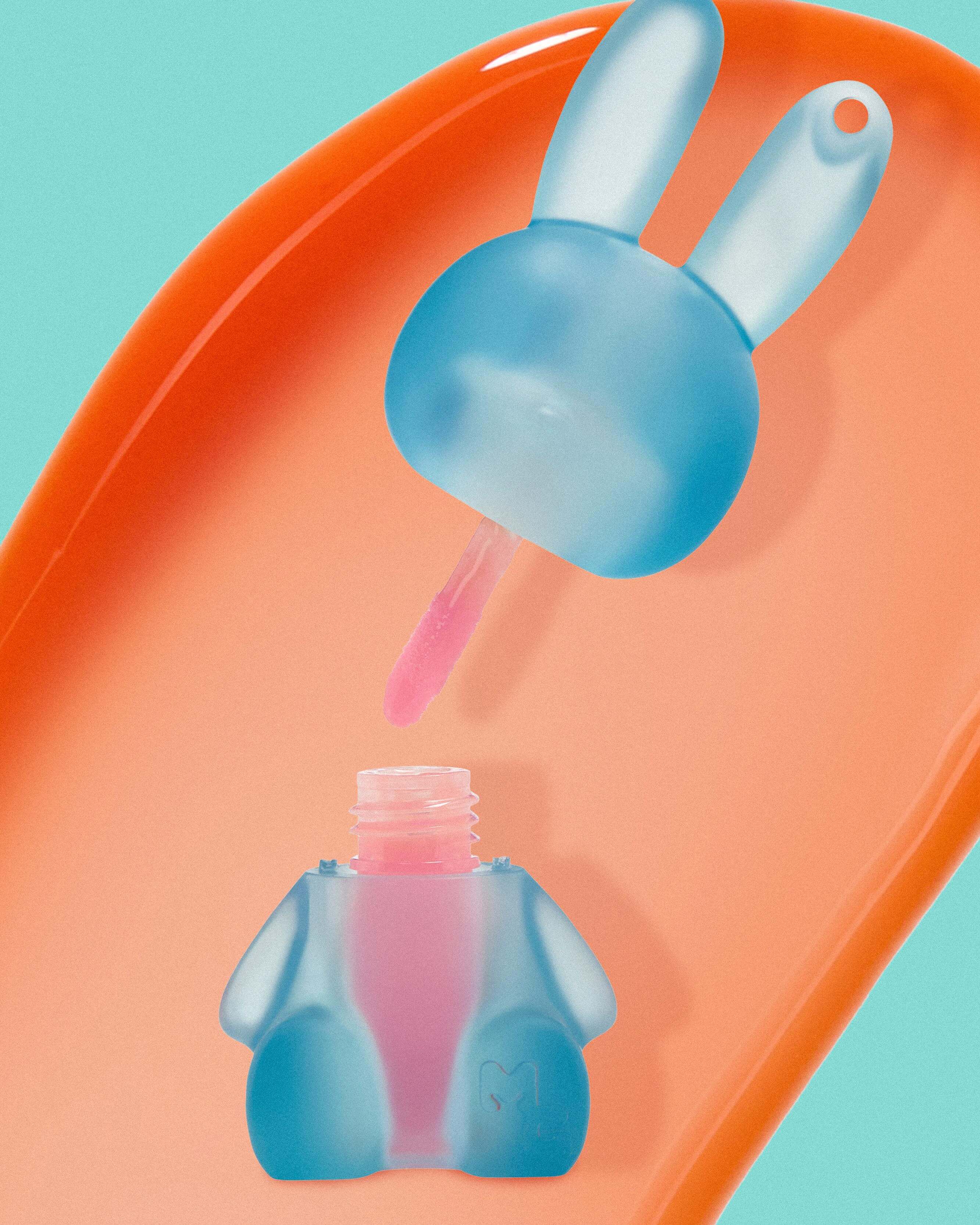 Bluelip gloss bottle  on an orange gloss against a teal background