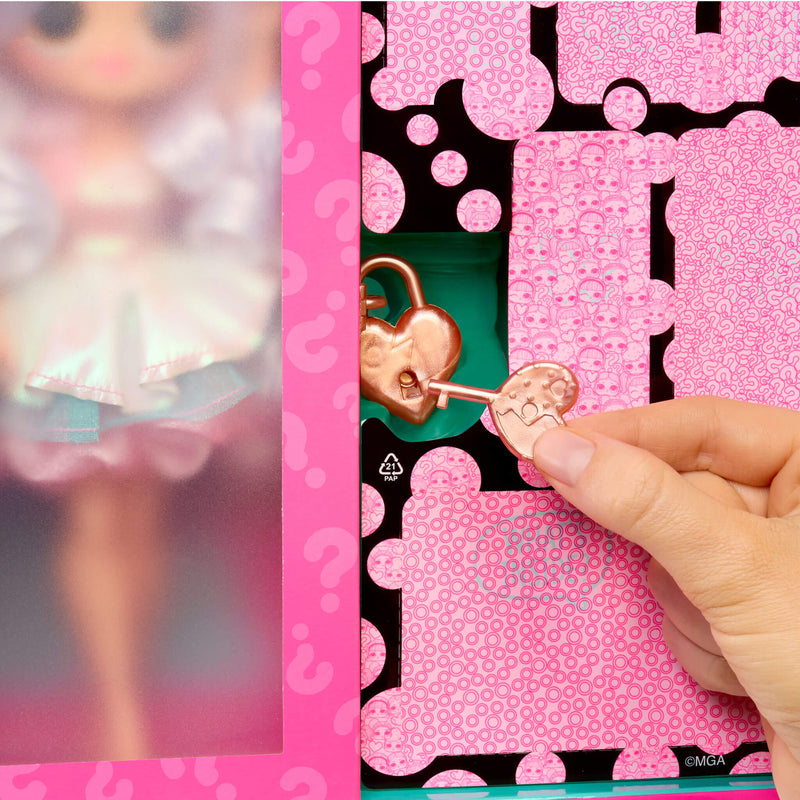 Pink heart-shaped keychain with a hand interacting with it against a pink and black patterned background.