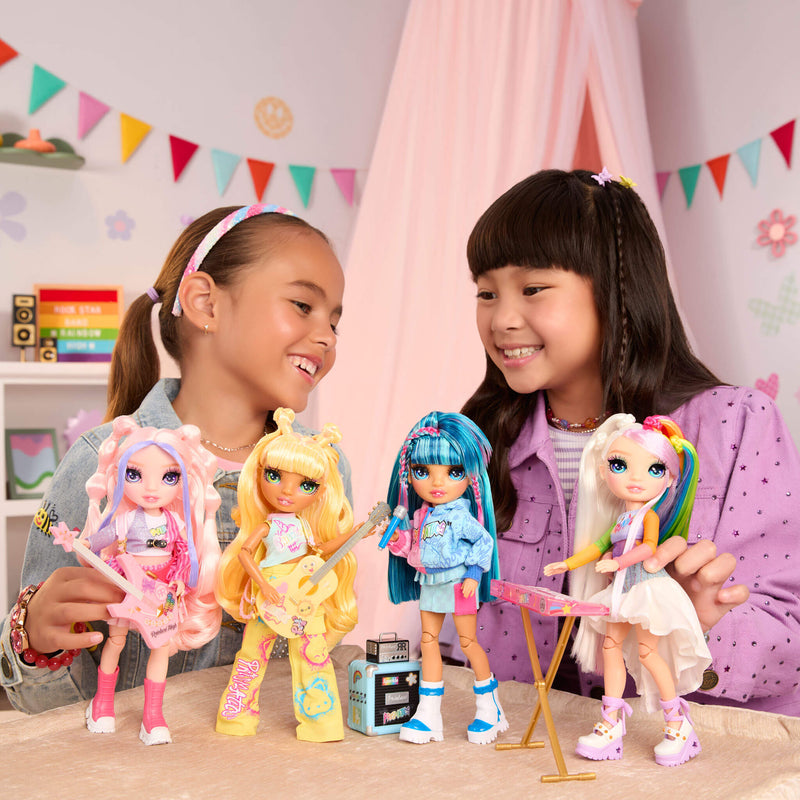 Two children playing with all four Rock Band dolls in a room decorated with flags.