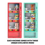 Two mini vending machine style snack boxes shown side by side on a white background, one red and one teal each stocked with candy and chips. Text below reads: 'EACH MACHINE COMES WITH THREE UNIQUE EXCLUSIVE MINIS!'.