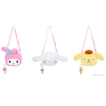 Three Sanrio plush crossbody bags lined up on a white background: pink My Melody with a blue bow, white Cinnamoroll with blue eyes, and yellow Pompompurin with a brown pom-pom. Each bag has a pink strap and a small character keychain.