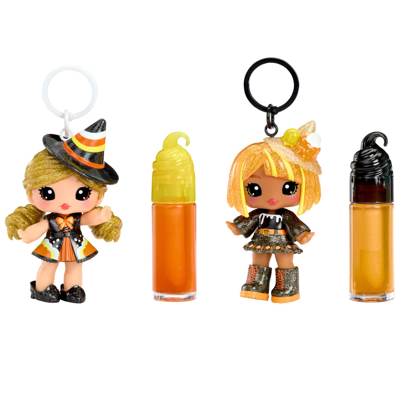 Cassie Treats and Blair Treats Halloween-themed keychains with small dolls and lip balms on a white background