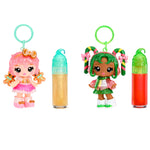 Gigi Gingerbread and Halle Candy Cane keychains with dolls and lip glosses on a white background