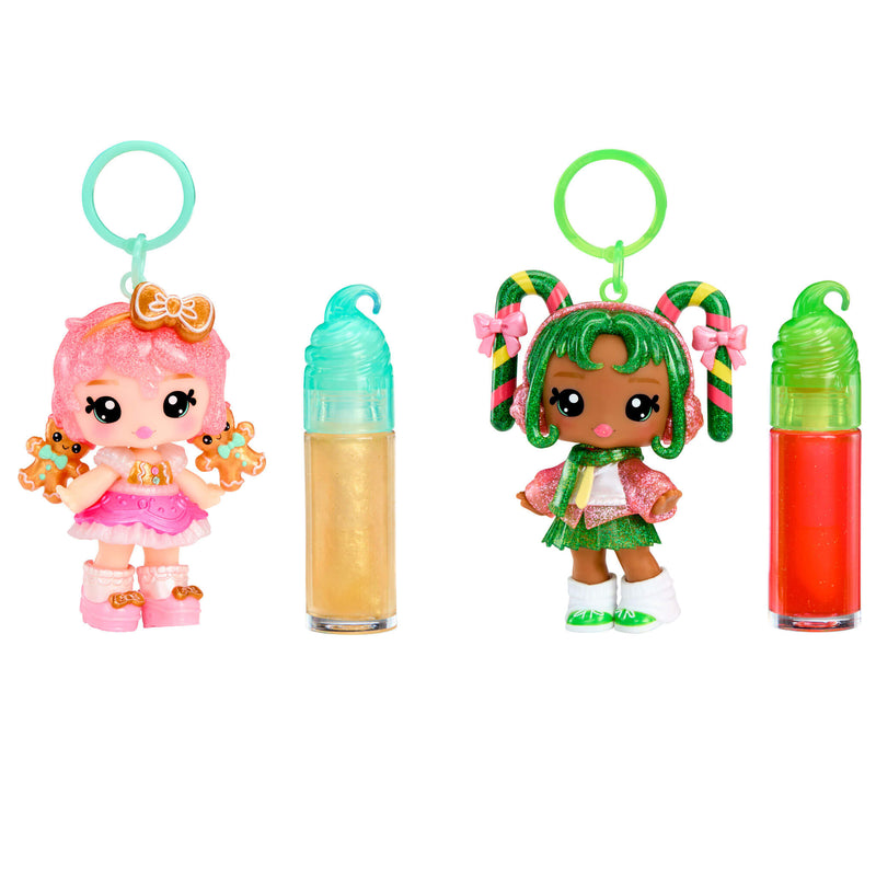 Gigi Gingerbread and Halle Candy Cane keychains with dolls and lip glosses on a white background