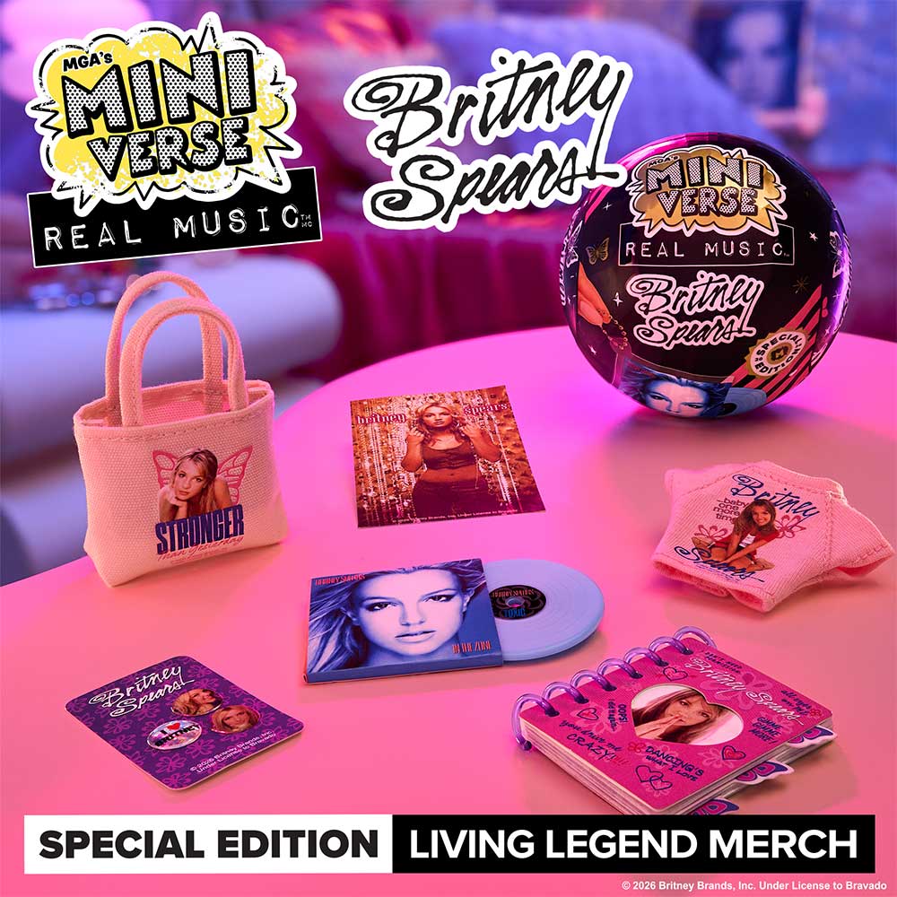 A promotional display of Britney Spears 'Mini Verse: Real Music' special edition merchandise arranged on a pink table.