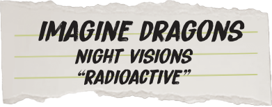 Album cover with 'Imagine Dragons' text on a torn paper background